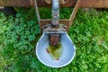 Close-up of waterer in an old mobile livestock water tank on an agricultural plot