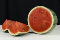 Close-up watermelon on concrete table and black color background Royalty Free Stock Photo