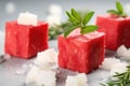 close-up of watermelon cubes beside crumbled feta cheese Royalty Free Stock Photo