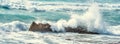 Close up of a wave crashing against the rocks in Porto Ferro shore Royalty Free Stock Photo