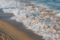 Close-up of a wave hitting a beach Royalty Free Stock Photo