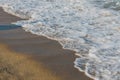 Close-up of a wave hitting a beach Royalty Free Stock Photo