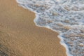 Close-up of a wave hitting a beach Royalty Free Stock Photo