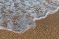 Close-up of a wave hitting a beach Royalty Free Stock Photo