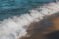 Close-up of a wave hitting a beach Royalty Free Stock Photo