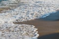 Close-up of a wave hitting a beach Royalty Free Stock Photo