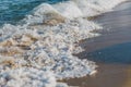 Close-up of a wave hitting a beach Royalty Free Stock Photo