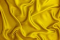 Close up wave yellow gold silk or satin fabric background Royalty Free Stock Photo