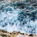 Close-up of waves breaking against the cliff face in Portugal Royalty Free Stock Photo