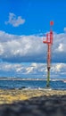 close-up of waves and a navigation buoy in a sea that merges with the sky Royalty Free Stock Photo