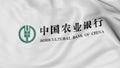Close up of waving flag with Agricultural Bank of China logo, 3D rendering