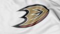 Close-up of waving flag with Anaheim Ducks NHL hockey team logo, 3D rendering