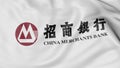 Close up of waving flag with China Merchants Bank logo, 3D rendering