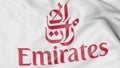 Close-up of waving flag with Emirates Airline logo, editorial 3D rendering