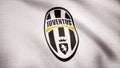 Close-up of waving flag with FC Juventus football club logo, seamless loop. Editorial animation