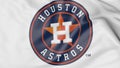 Close-up of waving flag with Houston Astros MLB baseball team logo, 3D rendering