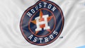 Close-up of waving flag with Houston Astros MLB baseball team logo, seamless loop, blue background. Editorial animation