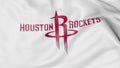 Close-up of waving flag with Houston Rockets NBA basketball team logo, 3D rendering