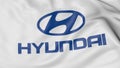 Close up of waving flag with Hyundai Motor Company logo, 3D rendering