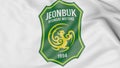 Close-up of waving flag with Jeonbuk Hyundai Motors FC football club logo, 3D rendering