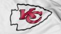 Close-up of waving flag with Kansas City Chiefs NFL American football team logo, 3D rendering