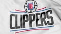 Close-up of waving flag with Los Angeles Clippers NBA basketball team logo, 3D rendering