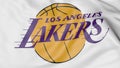 Close-up of waving flag with Los Angeles Lakers NBA basketball team logo, 3D rendering