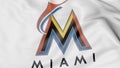 Close-up of waving flag with Miami Marlins MLB baseball team logo, 3D rendering