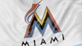 Close-up of waving flag with Miami Marlins MLB baseball team logo, seamless loop, blue background. Editorial animation