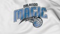 Close-up of waving flag with Orlando Magic NBA basketball team logo, 3D rendering