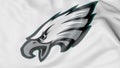 Close-up of waving flag with Philadelphia Eagles NFL American football team logo, 3D rendering