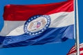 Close up of waving flag of the state of Missouri with blue sky i