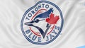 Close-up of waving flag with Toronto Blue Jays MLB baseball team logo, seamless loop, blue background. Editorial