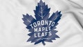 Close-up of waving flag with Toronto Maple Leafs NHL hockey team logo, 3D rendering Royalty Free Stock Photo