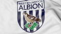 Close-up of waving flag with West Bromwich Albion FC football club logo, 3D rendering Royalty Free Stock Photo