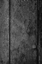 Closeup of a weathered and aged wooden door background in black and white Royalty Free Stock Photo