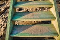 Close up of Weathered and Sandy Beach Stairs