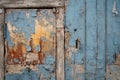 A close-up of a weathered wooden door with peeling paint Royalty Free Stock Photo