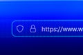 Close up of a web browser search bar on a blue pixelated screen showing a secure https prefix with a flashing cursor Royalty Free Stock Photo