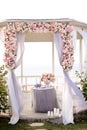 Close up wedding arch decorated by roses.