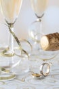 A close up of wedding bands with champagne flutes and gold ribbon in behind. Royalty Free Stock Photo