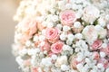 Close up wedding bouquet of gypsophila and pink spray roses flowers. White and pink wedding bouquet.