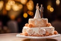 Close up of wedding cake with bride and groom figurine on top