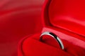 Close up of wedding ring at red velvet jewelry box Royalty Free Stock Photo