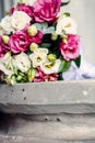 Close-up of wedding rings on background wedding bouquet of roses of berries and greens with lavender Royalty Free Stock Photo