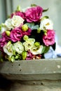 Close-up of wedding rings on background wedding bouquet of roses of berries and greens with lavender Royalty Free Stock Photo