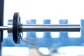 Close up weight plate fixed on barbell in gym Royalty Free Stock Photo