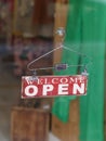 Close-up of Welcome Open sign