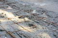 A close-up of a welded wire fabric in concrete floor slab. Reinforcing bar mesh installed horizontally in concrete floor