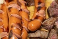 Close-up of well-cooked steaks and sausages
